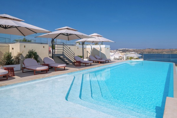 Indoor pool, outdoor pool, pool umbrellas, pool loungers