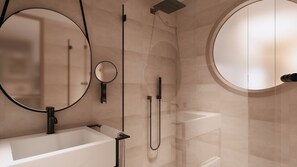 A modern bathroom with a large mirror, a round mirror, a bathtub, and a shower area. - Innside By Meliá Bugibba (St. Paul's Bay)
