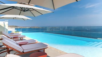 Indoor pool, outdoor pool, pool umbrellas, sun loungers