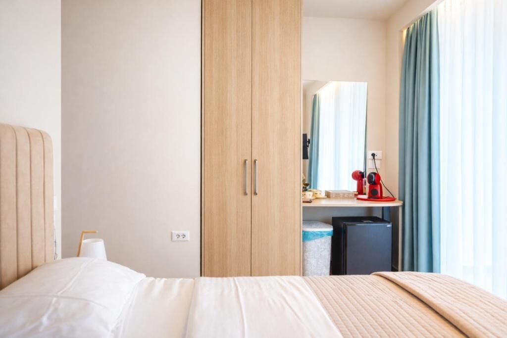 Chambre Triple Deluxe, balcon, vue partielle sur la mer