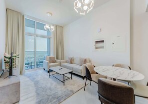 TV, offices - Newly Furnished Premium 1BR | Miracle Garden View (Dubai)
