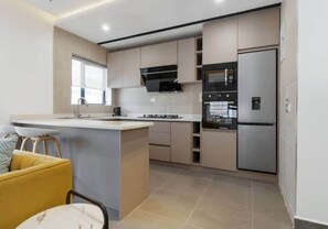 Fridge, microwave, oven, stovetop - Oasis| Modern Stay in Lekki Phase 1, Lagos. (Lekki)