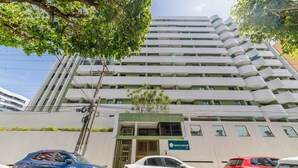 A multi-story building with a modern design, featuring a prominent entrance with a green awning and a sign for "Monte Berrone 516". - Building w/ Pool Just 700m fr/ Ponta Verde Beach - Mbrs (Maceió)