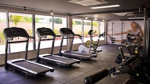 A gym with treadmills, an elliptical, and weight machines. - Puerto Ventura #305 - Joao Pessoa by Carpediem (João Pessoa)