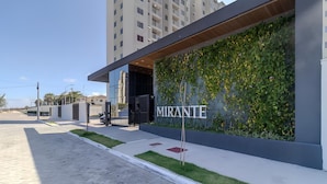 A modern building with a large wall covered in greenery and the word "MIRANTE" visible. - Mirante Clube #606 - Apto 2 Quartos by Carpediem (Fortaleza)