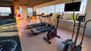 A gym with treadmills, a stationary bike, and a trampoline. - Mirante #407 - Two-bedroom Apt By Carpediem (Fortaleza)