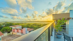 A balcony with a view of a distant landscape and a clear sky. - Ora Beach #315 - Porto de Galinhas by Carpediem (Ipojuca)