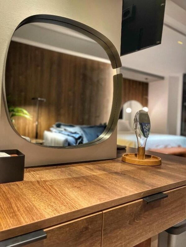 Deluxe Suite, Balcony, Sea View | In-room safe, blackout drapes, soundproofing, iron/ironing board