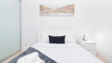 Suite, Balcony, City View | Desk, iron/ironing board, free WiFi