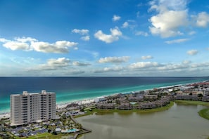 A coastal resort with a large hotel, a marina, and a beach. - Gorgeous gulfview condo with spacious balcony, shared pool, hot tub& beach access (Miramar Beach)