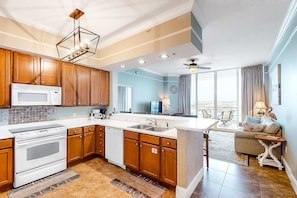 Fridge, microwave, oven, stovetop - Destin West Gulfside PH03 - Condo with partial Gulf view, fitness center, pools, & beach access - near shops (Fort Walton Beach)