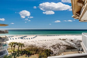 On the beach - Beachfront condo with beach chairs, an umbrella, and a pool (Fort Walton Beach)