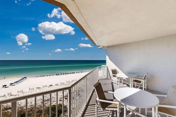 Property grounds - Beachfront condo with beach chairs, an umbrella, and a pool (Fort Walton Beach)