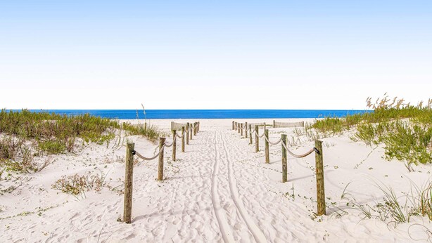 A sandy beach path leading to the ocean, bordered by wooden posts and ropes. - Waterfront Home Close to Beach w/ Shared Pool, Hot Tub, Free WiFi, & Central AC (Mexico Beach)