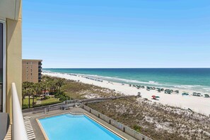A pool with a view of the beach and ocean. - Inviting 5th Floor Condo On Okaloosa Island Gulf-Front Views Beach Chairs (Fort Walton Beach)