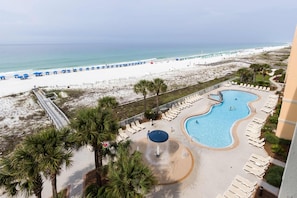 A resort with a pool, beach view, and lounge chairs. - Gulf Front Condo Pools Onsite, Nearby Activities, Shops, Restaurants (Fort Walton Beach)