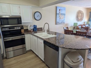 Fridge, microwave, oven, stovetop - Beautiful Gulf-front Condo with a Community Pool and Seasonal Beach Service (Fort Walton Beach)