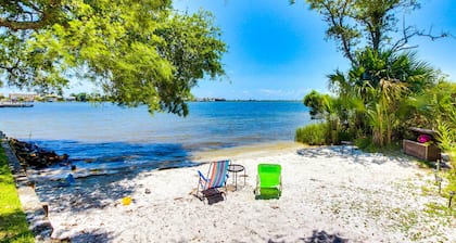 Inviting bayfront suite with water views, picnic area & pool