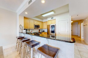 Fridge, microwave, oven, stovetop - Beachfront condo with balcony, hot tub, pool, gym, open layout, W&D, & AC (Fort Walton Beach)