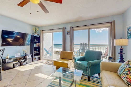 Cozy beachfront condo with private balcony, shared pool and beach access!