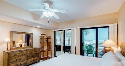 Beachfront condo with pool, Gulf-view balcony, central AC, & washer/dryer