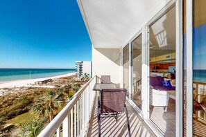 Outdoor dining - Spacious coastal condo on Okaloosa Island with Gulf-front views - steps to beach (Fort Walton Beach)