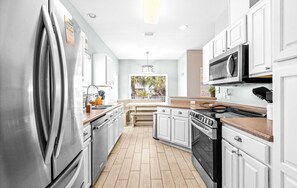 Fridge, microwave, oven, stovetop - Stunning Beach Retreat with Shared Pool, Beach Access, Large Balcony & Gas Grill (Pensacola Beach)