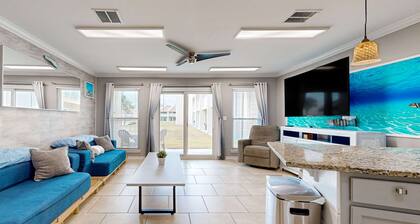 Ground-floor beach condo w/ a full kitchen, shared saltwater pool, & playground