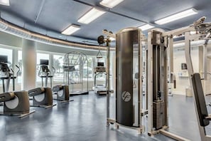 A modern gym with various exercise machines, large windows, and a clean, well-lit interior. - Sixth-floor condo with partial Gulf views, pools, hot tub, private beach (Fort Walton Beach)