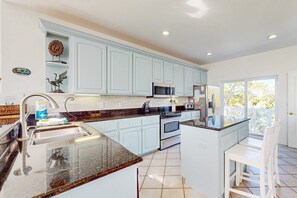 Fridge, microwave, oven, stovetop - Newly renovated home with tennis, private pool, deck, & fireplace - dog-friendly (St. George Island)