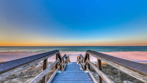 A wooden boardwalk leading to a beach with a clear sky. - Family-friendly 13th-floor condo w/furnished balcony, shared tennis, and pool (Miramar Beach)