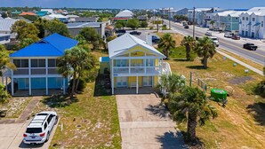A residential area with houses, a street, and a parked car. - Dog-friendly coastal home with a game room and covered patio (Port St. Joe)