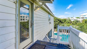A house with a pool, a wooden deck, and a view of the surrounding area. - Dog-friendly, Gulf-view home with pool, decks, WiFi, & WD - walk to beach (Santa Rosa Beach)