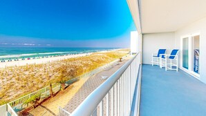 A balcony with a view of the beach and ocean. - Gulf-front condo with balcony, ocean view, W&D, pool, & fitness room (Fort Walton Beach)