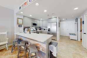 Fridge, microwave, oven, stovetop - 11th floor oceanfront condo with pool, hot tub, ocean view, W/D, and central AC (Pensacola Beach)