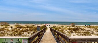 Comfortable townhome steps from beach with pool access, balcony, & W/D