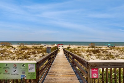 Comfortable townhome steps from beach with pool access, balcony, & W/D