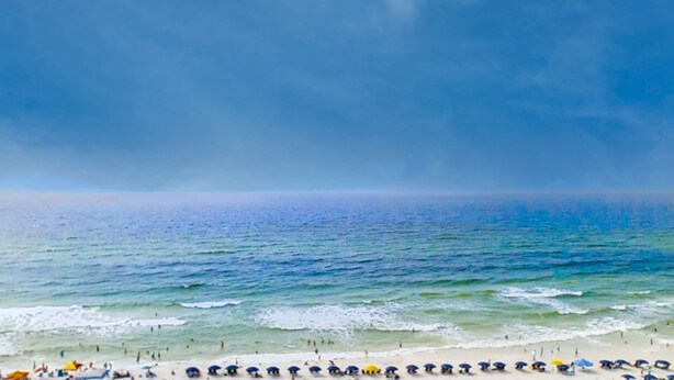 A beach with people and umbrellas. - Majestic Sun A806 Beachfront Views & Pool Fun! (Miramar Beach)