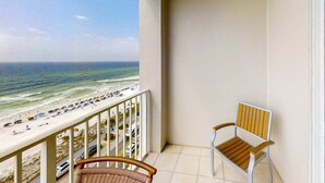 A balcony with a view of the beach and ocean. - Majestic Sun A806 Beachfront Views & Pool Fun! (Miramar Beach)
