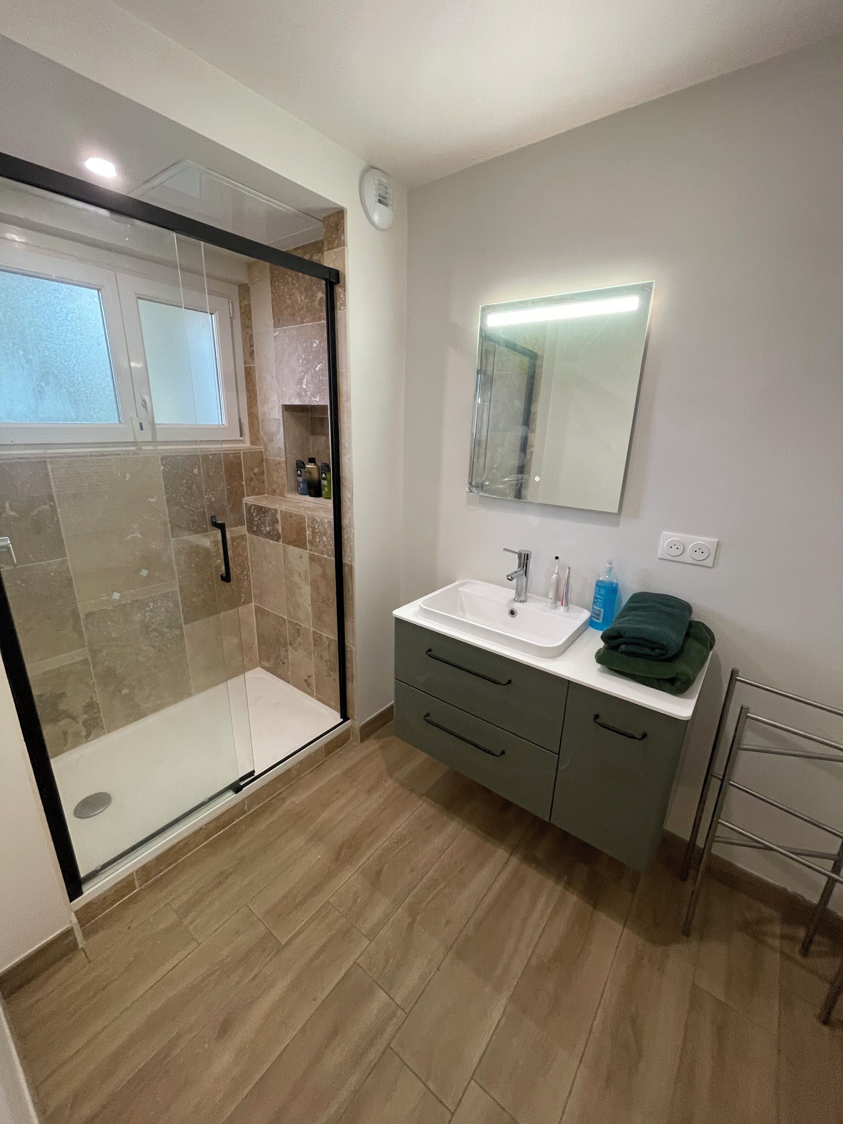 Shower, hair dryer, towels, soap