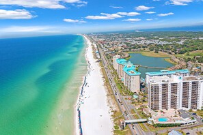A coastal hotel with multiple high-rise buildings, a beach, and a marina. - Gulf-front studio with gorgeous views, shared pool & hot tub, central AC, WiFi (Miramar Beach)