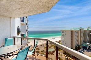 Outdoor dining - Spacious oceanfront condo with pool, hot tub, & beach view (Miramar Beach)