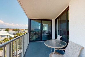 Outdoor dining - Waterfront corner condo w/ shared pool, pool spa, fitness room, & beach service (Miramar Beach)