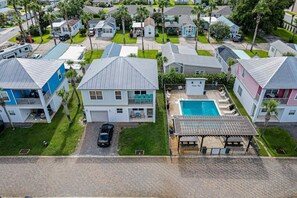 A residential area with houses, a swimming pool, and a covered patio. - Sunny Side Up Santa Rosa beach (Miramar Beach)