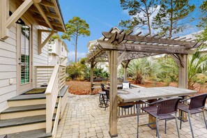 Outdoor dining - Gorgeous coastal home with pool, bikes, & large balcony - near beaches & parks (Santa Rosa Beach)