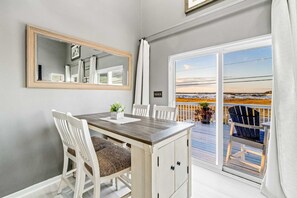 Dining - Lovely home with sound view, balcony, full kitchen, central AC, & washer/dryer (Navarre Beach)