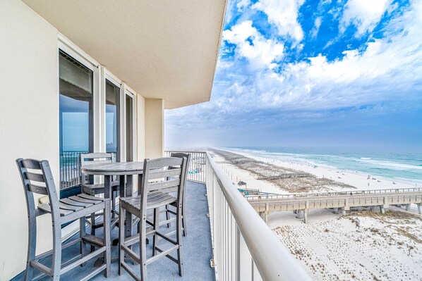 Outdoor dining - Sixth-floor Gulf-front condo with water views, pool, hot tub & covered parking (Navarre Beach)