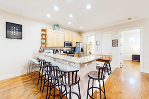 Fridge, microwave, oven, stovetop - Dog-friendly home with balconies, foosball, pool access, & W&D - steps to beach (Panama City Beach)