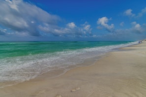 A beach with clear turquoise waters and a sandy shore. - Completely Remodeled Beachside Studio with Pool - Snowbirds Welcome (Inlet Beach)