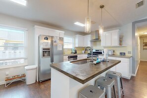 Fridge, microwave, oven, stovetop - Dog-friendly home near beach with enclosed yard, grill, W&D, AC, garage, & WiFi (Panama City Beach)